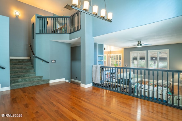 1500 Backer Way, Reno, NV 89523 - unfurnished living room with a chandelier, wood finished floors, and ceiling fan
