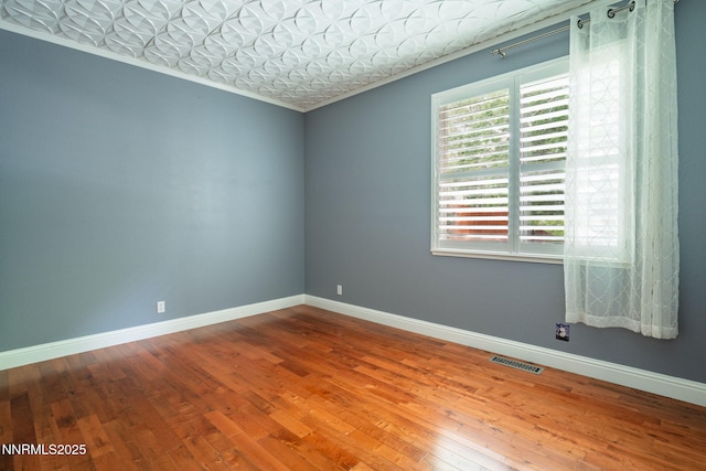 1500 Backer Way, Reno, NV 89523 - empty room featuring hardwood / wood-style floors, crown molding, and an ornate ceiling