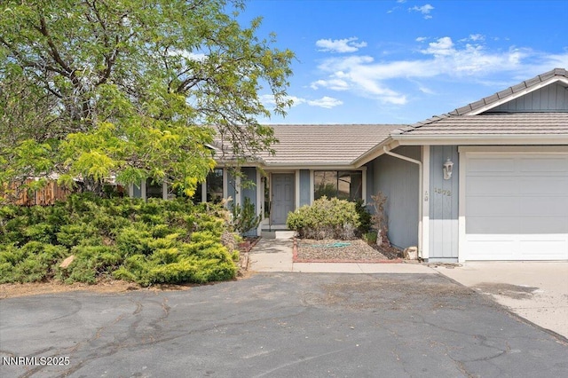 1372 Laser Ct, Sparks, NV 89436 - ranch-style home featuring a tiled roof and an attached garage