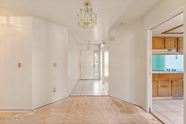 1372 Laser Ct, Sparks, NV 89436 - hall featuring a chandelier and light tile patterned flooring