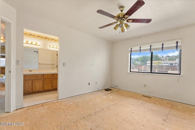 1372 Laser Ct, Sparks, NV 89436 - unfurnished bedroom featuring connected bathroom and a sink