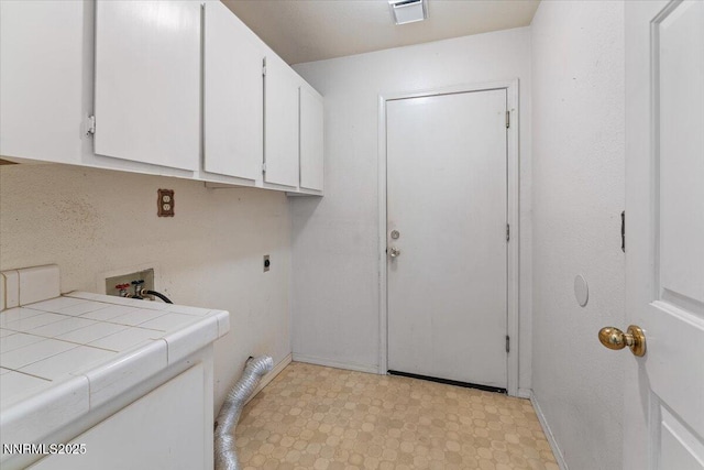 1372 Laser Ct, Sparks, NV 89436 - laundry area with electric dryer hookup, cabinet space, and light flooring
