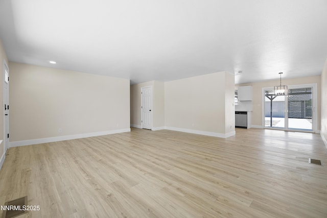 1000 Dwight Way, Dayton, NV 89403 - unfurnished living room with light wood-style floors, a chandelier, baseboards, and recessed lighting