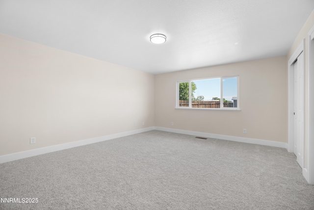 1000 Dwight Way, Dayton, NV 89403 - unfurnished bedroom with light carpet, baseboards, and a closet