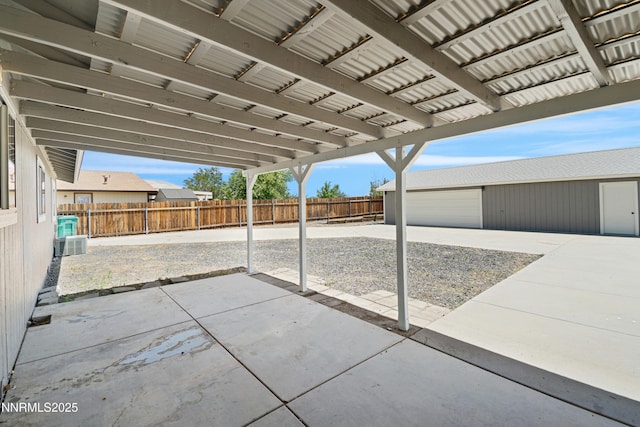 1000 Dwight Way, Dayton, NV 89403 - fenced backyard with an outdoor structure and a patio area