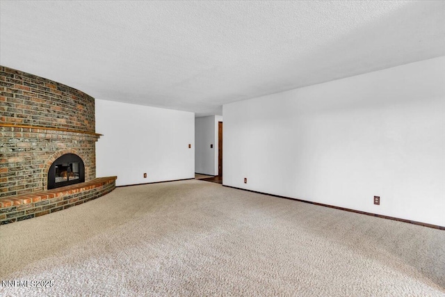 1809 Franklin Rd, Carson City, NV 89706 - unfurnished living room featuring carpet flooring, baseboards, a textured ceiling, and a fireplace