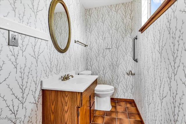 1809 Franklin Rd, Carson City, NV 89706 - half bathroom with wallpapered walls, toilet, vanity, and tile patterned floors