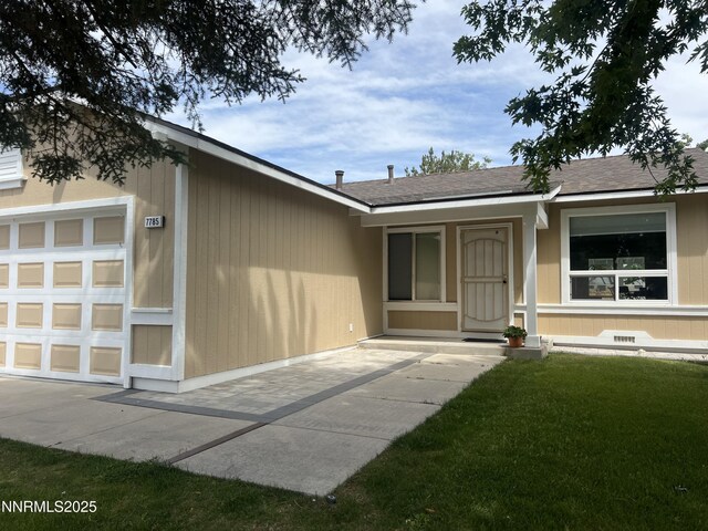 7785 Crystal Shores Dr, Reno, NV 89506 - doorway to property featuring a lawn, a shingled roof, and a garage