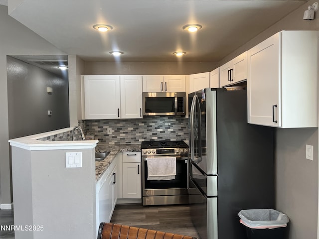 7785 Crystal Shores Dr, Reno, NV 89506 - kitchen featuring stainless steel appliances, dark wood finished floors, and white cabinetry