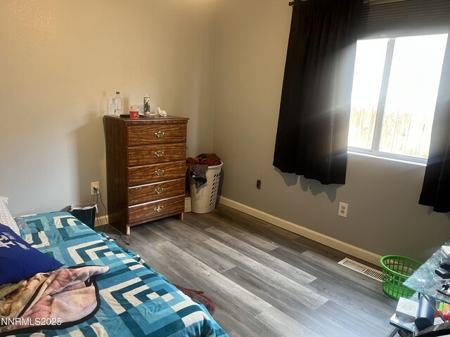 7785 Crystal Shores Dr, Reno, NV 89506 - bedroom featuring wood finished floors and baseboards