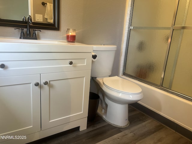 7785 Crystal Shores Dr, Reno, NV 89506 - bathroom featuring wood finished floors, vanity, and shower / bath combination with glass door