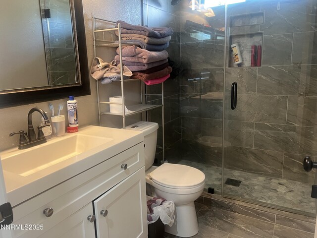 7785 Crystal Shores Dr, Reno, NV 89506 - bathroom with marble finish flooring, vanity, and a stall shower