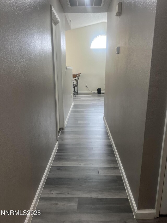 7785 Crystal Shores Dr, Reno, NV 89506 - hallway with baseboards and wood finished floors