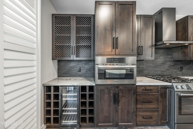 2978 Fox Trail Dr, Reno, NV 89523 - kitchen with wine cooler, appliances with stainless steel finishes, wall chimney range hood, and dark brown cabinetry