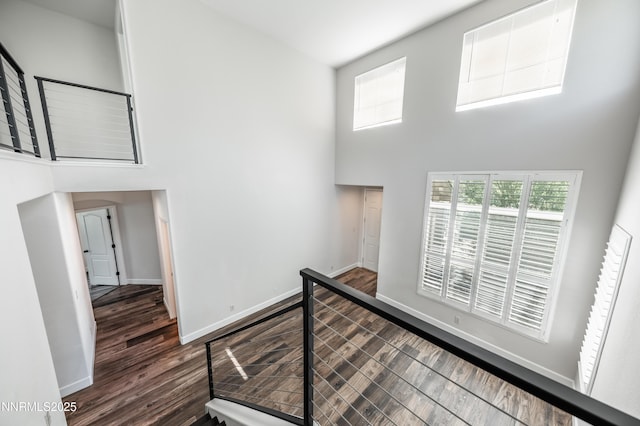 2978 Fox Trail Dr, Reno, NV 89523 - hallway featuring a towering ceiling and dark wood-style floors