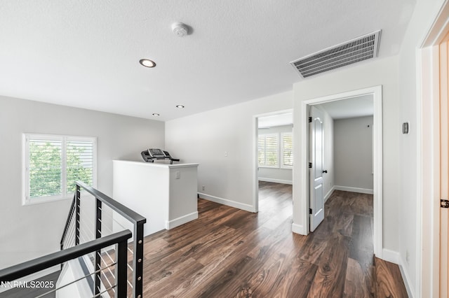2978 Fox Trail Dr, Reno, NV 89523 - hall with an upstairs landing, dark wood-style floors, recessed lighting, and a textured ceiling