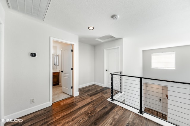 2978 Fox Trail Dr, Reno, NV 89523 - corridor featuring an upstairs landing, dark wood-style floors, recessed lighting, and a textured ceiling