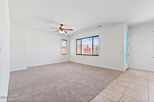 14373 Fredonia Dr, Reno, NV 89506 - empty room with a ceiling fan, light carpet, and light tile patterned flooring
