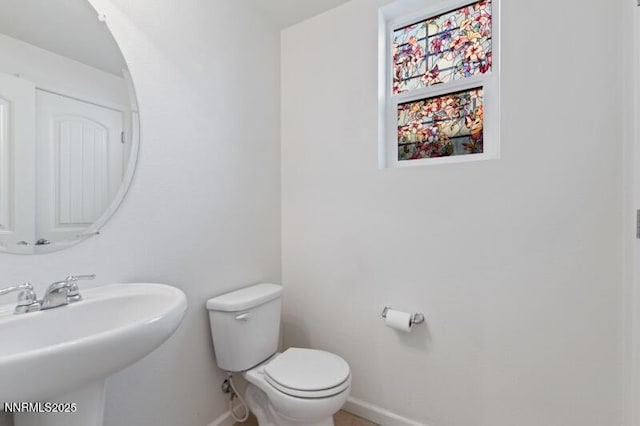 14373 Fredonia Dr, Reno, NV 89506 - half bath with baseboards and a sink