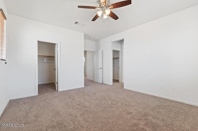 14373 Fredonia Dr, Reno, NV 89506 - unfurnished bedroom featuring light colored carpet, a spacious closet, and ceiling fan