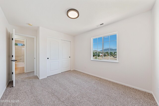 17705 Oakview Ct, Reno, NV 89508 - unfurnished bedroom featuring carpet floors and a closet
