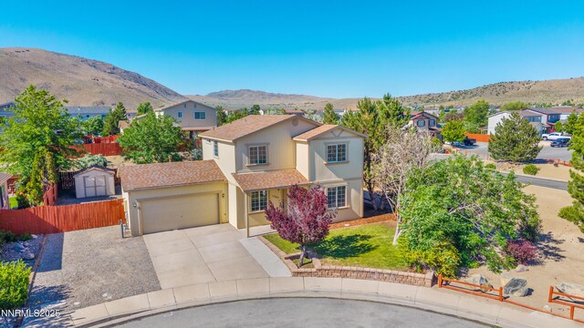 17705 Oakview Ct, Reno, NV 89508 - traditional-style house with a garage, concrete driveway, a mountain view, and a residential view