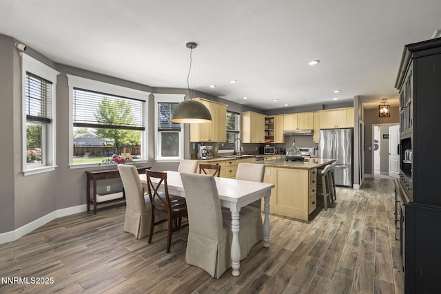3128 Wild Iris Ct, Sparks, NV 89436 - kitchen with freestanding refrigerator, a kitchen island, light brown cabinetry, dark wood finished floors, and recessed lighting