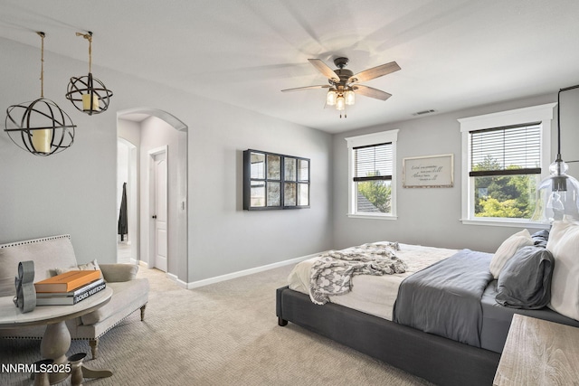 3128 Wild Iris Ct, Sparks, NV 89436 - bedroom featuring carpet flooring, arched walkways, and ceiling fan