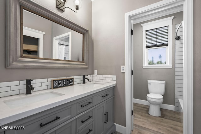 3128 Wild Iris Ct, Sparks, NV 89436 - full bath with double vanity, backsplash, wood finished floors, and a shower with curtain