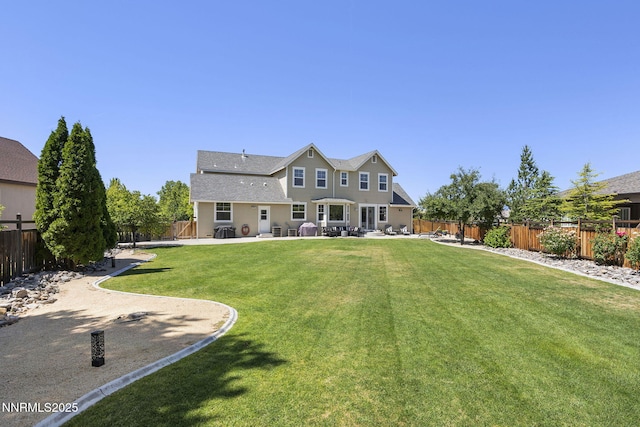 3128 Wild Iris Ct, Sparks, NV 89436 - rear view of house featuring a patio, a fenced backyard, and a shingled roof