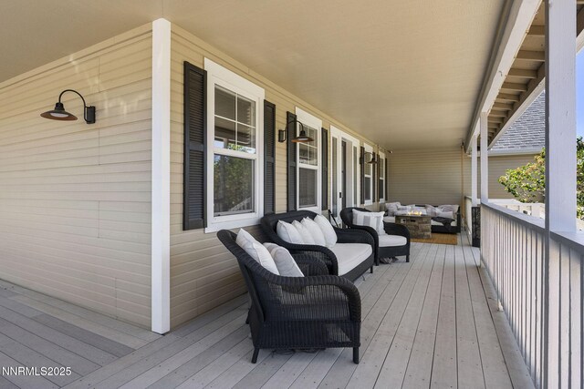 3128 Wild Iris Ct, Sparks, NV 89436 - wooden porch with an outdoor living space with a fire pit