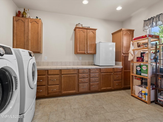 4903 Killdeer Rd, Carson City, NV 89701 - washroom with cabinet space, washer and clothes dryer, and recessed lighting