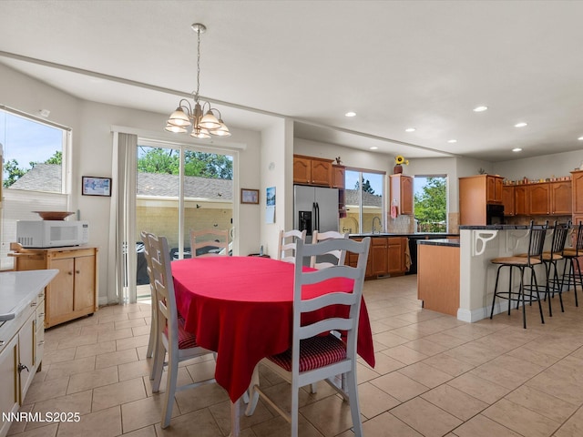 4903 Killdeer Rd, Carson City, NV 89701 - dining area with recessed lighting, plenty of natural light, a chandelier, and light tile patterned floors