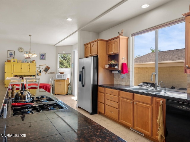 4903 Killdeer Rd, Carson City, NV 89701 - kitchen featuring black appliances, backsplash, light tile patterned floors, recessed lighting, and hanging light fixtures