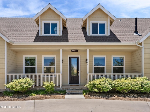 4903 Killdeer Rd, Carson City, NV 89701 - view of front of house featuring covered porch and a shingled roof