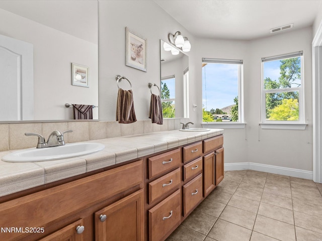 4903 Killdeer Rd, Carson City, NV 89701 - full bath with double vanity and tile patterned flooring