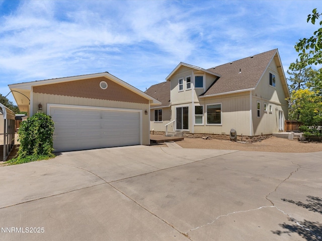 4903 Killdeer Rd, Carson City, NV 89701 - view of front of house with concrete driveway, roof with shingles, and an attached garage