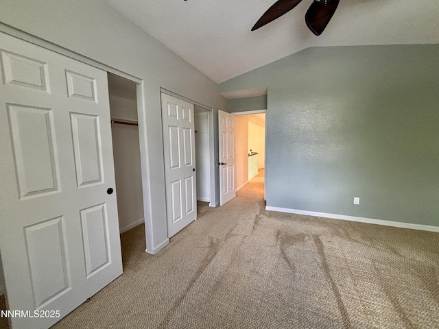 3882 Streamside Ct, Reno, NV 89519 - unfurnished bedroom with vaulted ceiling, carpet, and ceiling fan