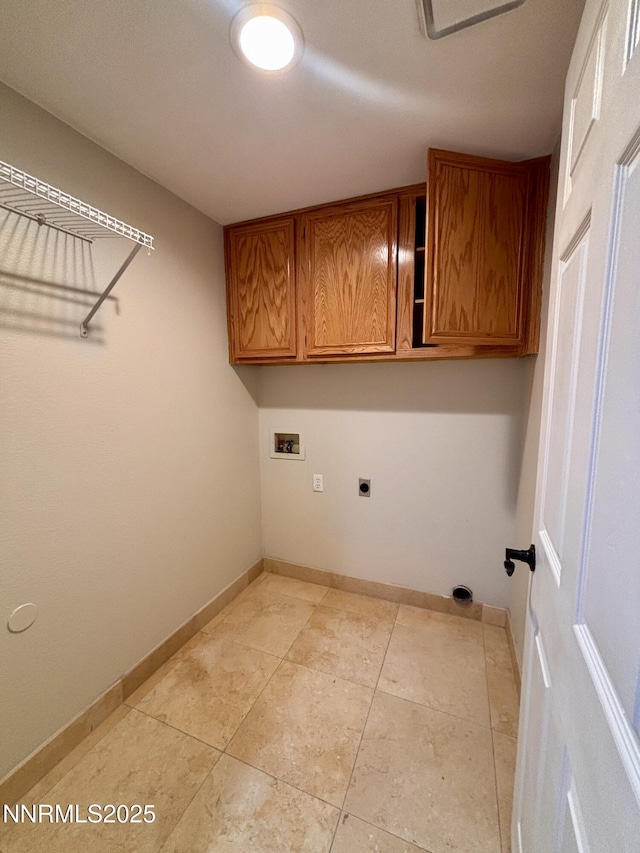 3882 Streamside Ct, Reno, NV 89519 - laundry room featuring hookup for a washing machine, cabinet space, light tile patterned flooring, and electric dryer hookup