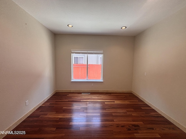 3882 Streamside Ct, Reno, NV 89519 - empty room featuring dark wood-style floors and recessed lighting