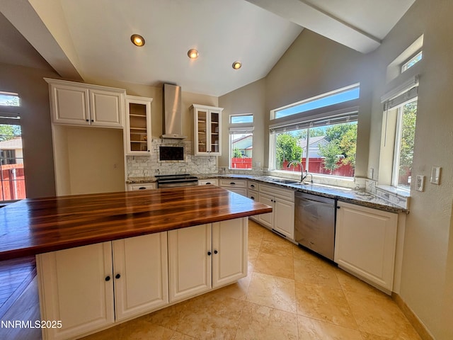 3882 Streamside Ct, Reno, NV 89519 - kitchen featuring wood counters, stainless steel appliances, wall chimney exhaust hood, tasteful backsplash, and plenty of natural light