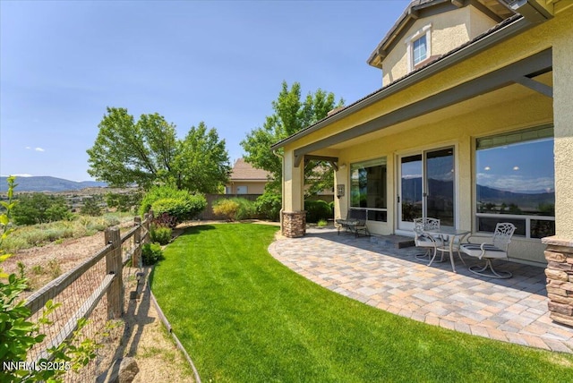 8692 18th Hole Trl, Reno, NV 89523 - fenced backyard with a patio area and a mountain view