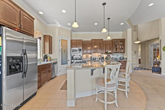 8692 18th Hole Trl, Reno, NV 89523 - kitchen featuring stainless steel appliances, ornamental molding, recessed lighting, a kitchen island with sink, and light tile patterned floors