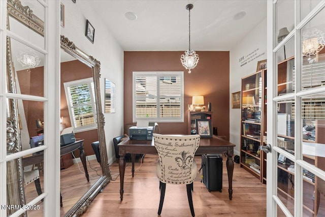 8692 18th Hole Trl, Reno, NV 89523 - office featuring wood finished floors, french doors, and a chandelier