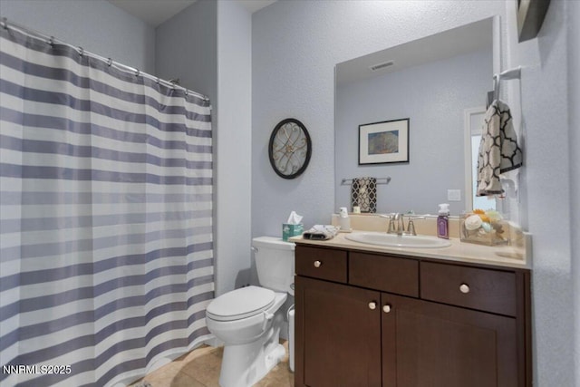 7324 Continuum Dr, Reno, NV 89506 - bathroom featuring tile patterned floors, vanity, a textured wall, and curtained shower