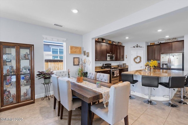 7324 Continuum Dr, Reno, NV 89506 - dining area featuring light tile patterned flooring and recessed lighting