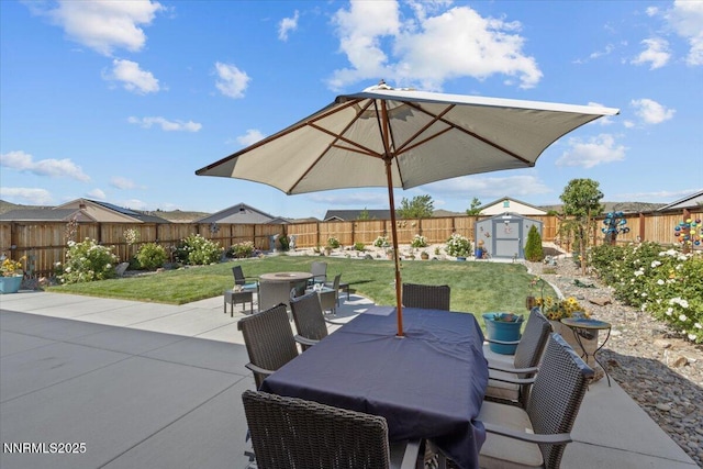 7324 Continuum Dr, Reno, NV 89506 - fenced backyard featuring a storage shed, outdoor dining space, a patio, and an outdoor fire pit