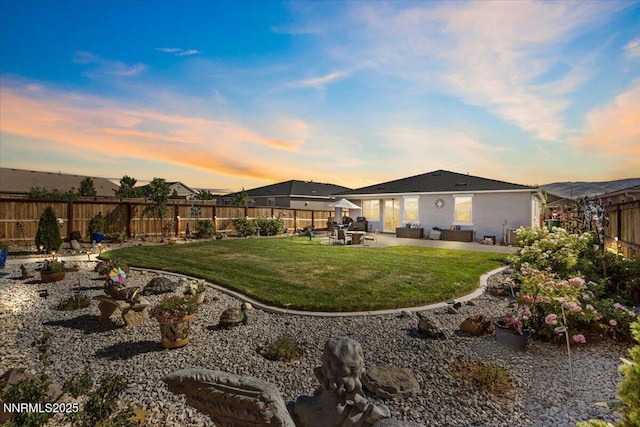 7324 Continuum Dr, Reno, NV 89506 - fenced backyard featuring a patio and an outdoor hangout area