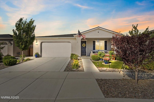 7324 Continuum Dr, Reno, NV 89506 - ranch-style house with a garage, concrete driveway, and stucco siding
