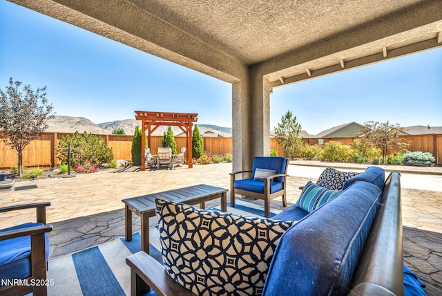 2222 Nasrullah Ln, Reno, NV 89521 - fenced backyard with an outdoor living space, a patio, and a mountain view